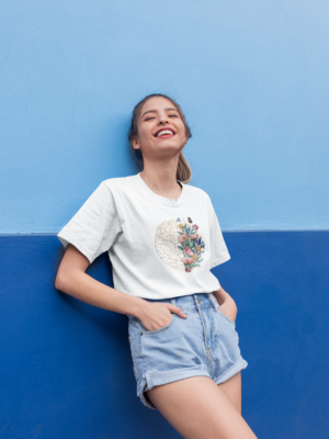 mockup-of-a-smiling-girl-wearing-a-round-neck-tee-leaning-against-a-wall-22956