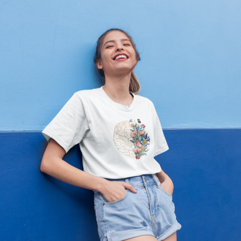 mockup-of-a-smiling-girl-wearing-a-round-neck-tee-leaning-against-a-wall-22956